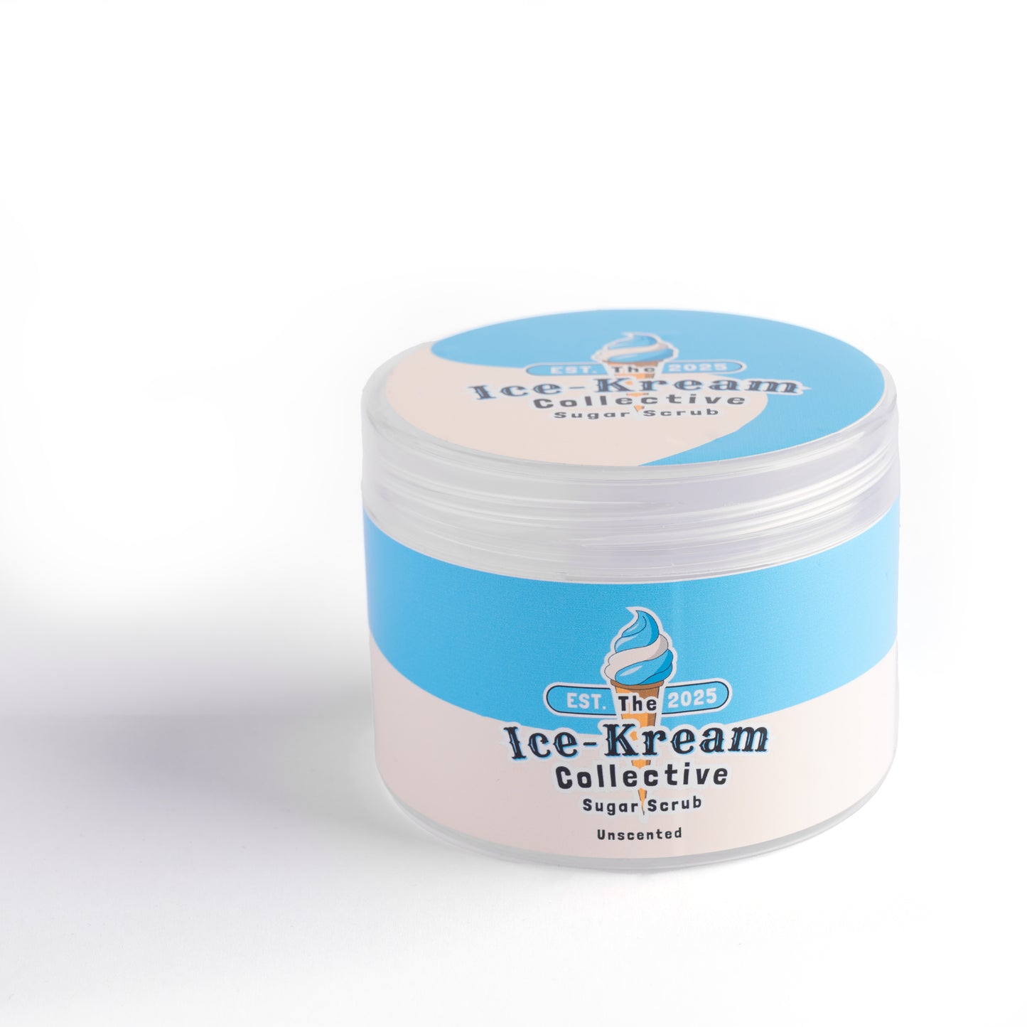 The Ice-Kream Collective Unscneted sugar scrub in a round jar with blue and cream packaging, labeled EST. 2025, on a white studio background.