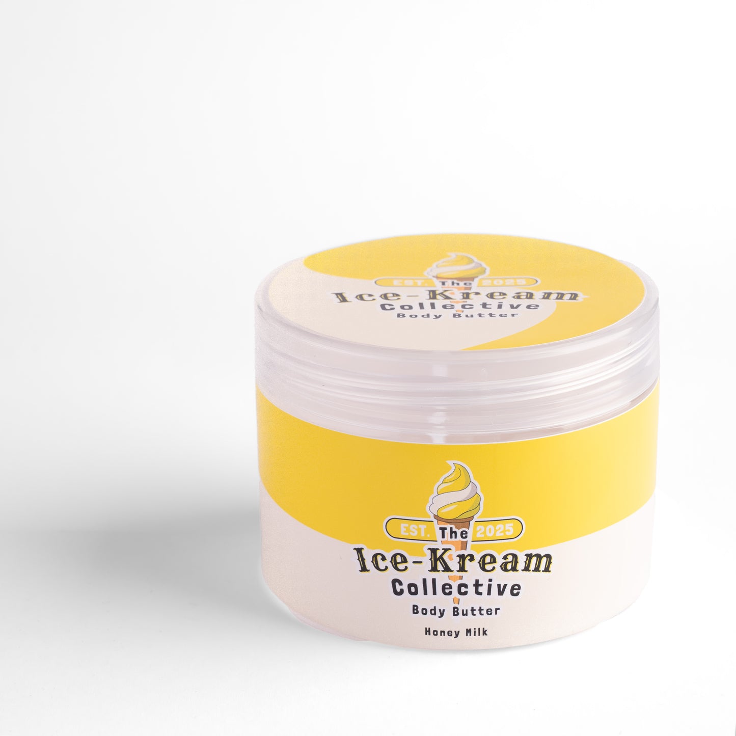 The Ice-Kream Collective Honey Milk body butter in a round jar with yellow and cream packaging, labeled EST. 2025, on a white studio background.