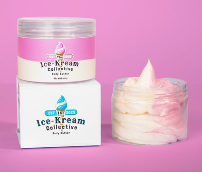 The Ice-Kream Collective Strawberry body butter in a clear jar with pink and cream packaging, displayed next to its branded box on a pastel pink background.